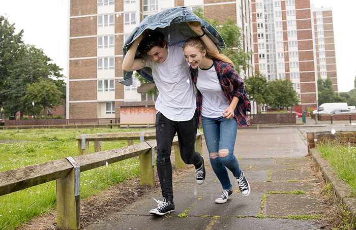 Couple running in the rain